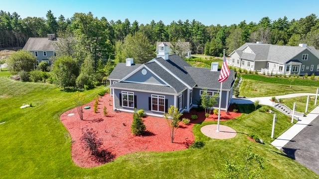 Exterior of a duplex-style luxury 55+ condominium at Trailside Estates, Rochester MA, with attached two-car garage