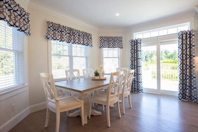 Sun-filled dining nook with backyard views in a Trailside Estates 55+ duplex-style luxury condominium